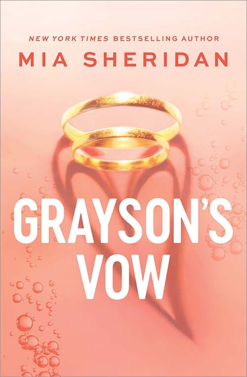 Grayson's Vow cover - Two gold rings, one larger one smaller, shadows forming a heart