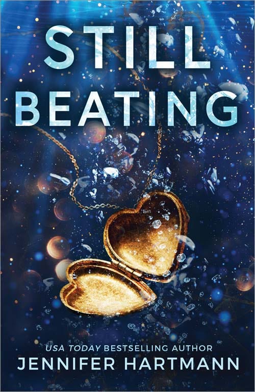 Still Beating cover - open, empty heart locket neckless sinking in water